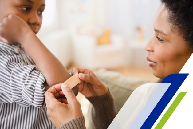 Girl with a tower in front of a mirror on a bathroom