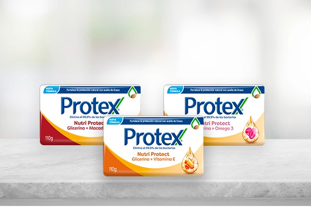 Girl with a tower in front of a mirror on a bathroom